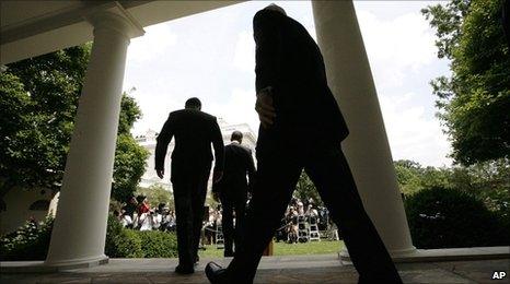 President Barack Obama followed by Gen David Petraeus and Defense Secretary Robert Gates