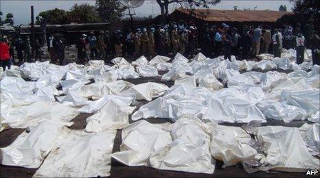 Sheets cover the bodies of those who died in the accident in Sange