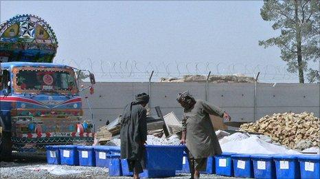 Election workers load ballot boxes onto a truck to be distributed to polling stations in Kandahar on September 16, 2010