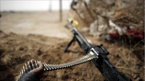 Gun held by a Libyan rebel ahead of fighting against Col Gaddafi's forces in Ajdabiya, Libya 2 March 2011