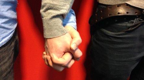 Gay men holding hands