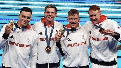  James Guy, Duncan Scott, Matthew Richards and Tom Dean of team Great Britain celebrate their Gold medal after the Men's 4x200m Freestyle Relay final on day four of the Olympic Games Paris 2024 