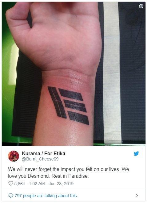 Etika's logo tattooed on an arm. Tweet beneath reads: We will never forget the impact you felt on our lives. We love you Desmond. Rest in Paradise.