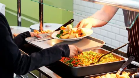 Getty Images Close up school dinner counter