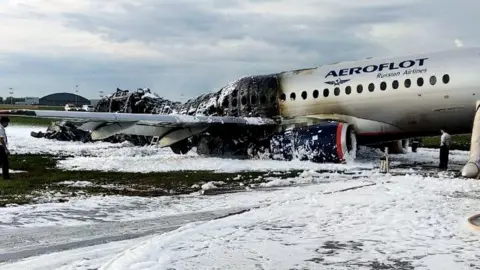 Reuters The damaged Aeroflot Sukhoi Superjet 100-95 passenger plane after an emergency landing at Moscow's Sheremetyovo airport