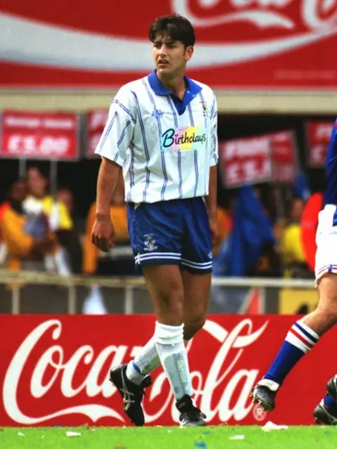 Colorsport/REX/Shutterstock Andy Woodward playing in 1995