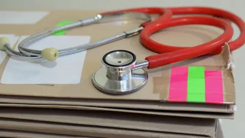 PA Media Stethoscope sat on stack of files