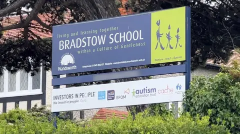 The Bradstow School sign, positioned outside the school building.