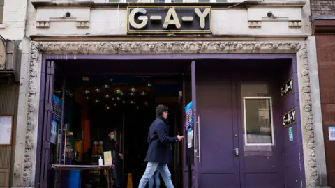 Getty Images A man walks past the "G-A-Y" bar and venue on 5 October 2020