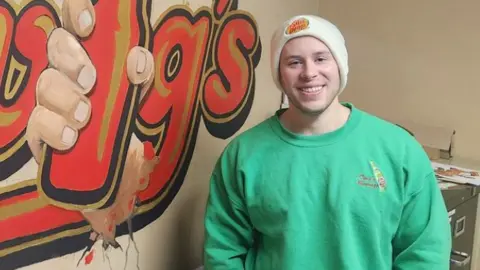 Twig's Twig's vice-president Ben Hartwig wearing a green sweater