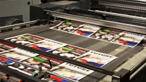 Rows of blurred pages emerging from a printer