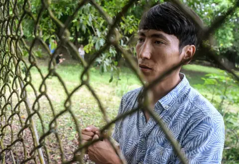 Afghan Mohammad Saber Asadi speaks during an AFP interview at the Temporary Care Center for Migrants (Catem) in Puntarenas, Costa Rica on March 23, 2025