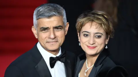 EPA Mayor of London Sadiq Khan (L) and his wife Saadiya Khan arrive for the world premiere of the new James Bond film