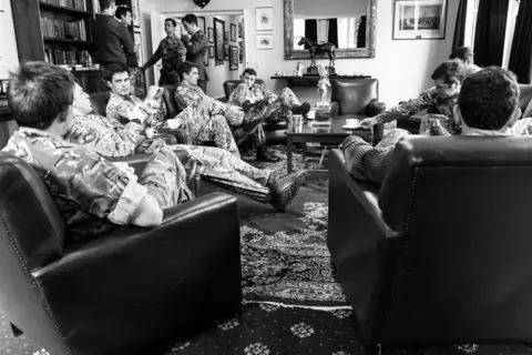 Tobias Wilkinson Officers of The Queen's Royal Hussars officers’ mess meet for coffee after lunch at Athlone Barracks. Sennelager, 2018