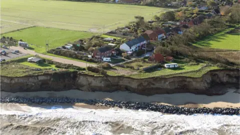 Mike Page Ariel view of Homes perilously close to the cliff edge at Happisburgh, north Norfolk