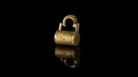Amgueddfa Cymru A gold combination lock