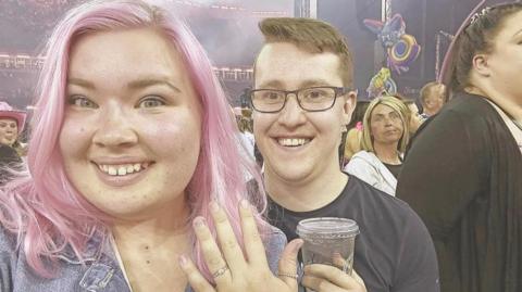 Josh and Ella with the engagement ring at the Pink concert