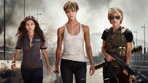 Paramount Pictures Natalia Reyes, Mackenzie Davis and Linda Hamilton as they appear in the next Terminator film