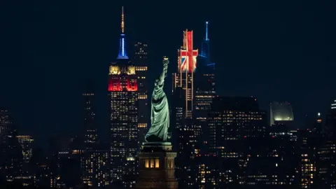 Anadolu via Getty Images The Empire State Building and JPMorgan Chase Building were illuminated in the colours of the United Kingdom flag on Tuesday, April 29, in honour of the visit of King Charles III and Queen Camilla to New York City.
