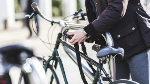 Getty Images Person locking bike
