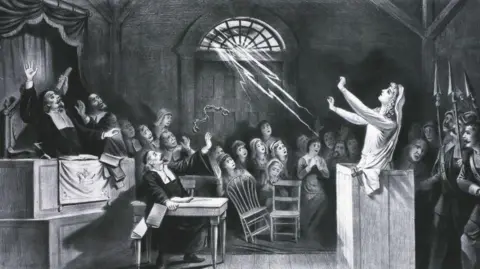 Getty Images Witch Trial, a young woman accused of witchcraft by Puritan ministers appeals to Satan to save her, circa 1692.