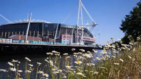 Getty Images Principality Stadium with the sun shining next to the River Taff.