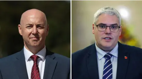 A composite image of Jon Burrows and Gavin Robinson. Both men are wearing navy suits and are looking ahead towards the camera. Burrows has a shaven head. Robinson has short grey hair and black-framed glasses.