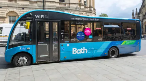 Getty Images A blue bus which says 'Bath City' on the side