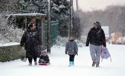 AFP People in the snow in Gateshead on 1 December 2023