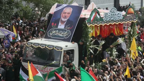 Reuters Iranians attend the funeral of assassinated Hamas leader Ismail Haniyeh in Tehran, Iran, August 1, 2024