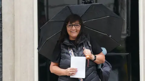 PA Media Figen Murray, parent  of Manchester Arena bombing unfortunate  Martyn Hett, arriving successful  Downing Street, London. 