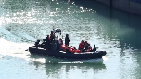 PA Media Migrants brought into Dover