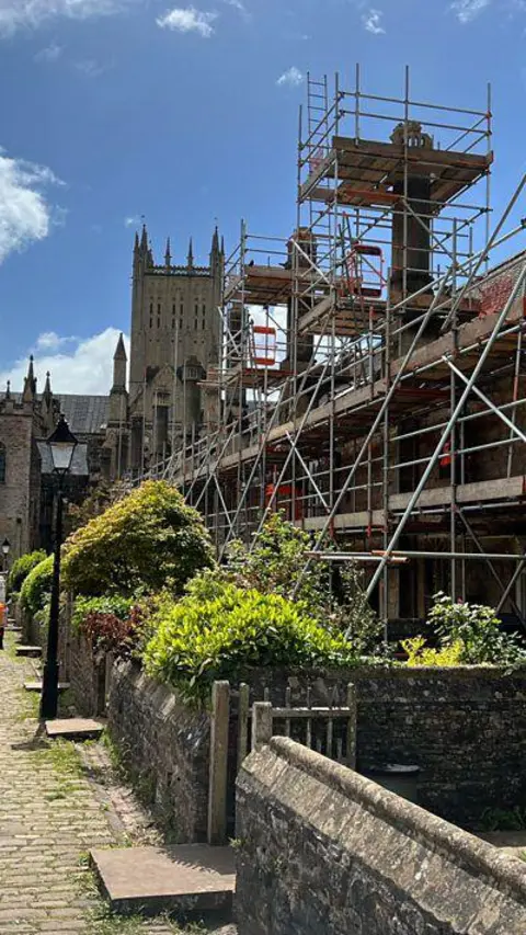 Scaffolding on a building on a Medieval street in Wells, Somerset.