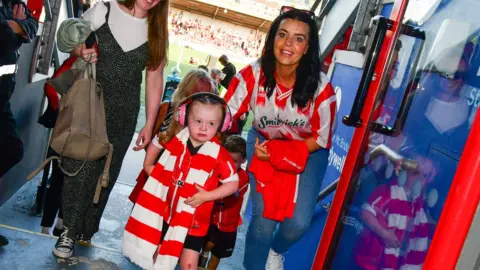 Kevin Morrison Zara Hamill at Derry football event