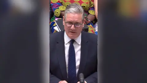 Keir Starmer in a suit in the House of Commons.