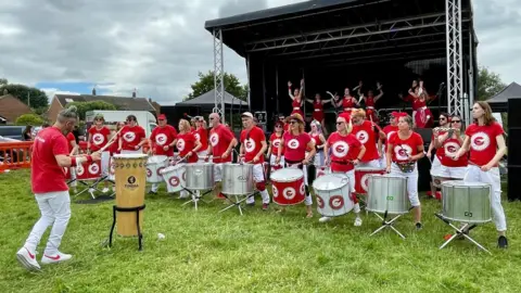 Bristol Samba Bristol Samba members line up to perform in Fishponds on Saturday