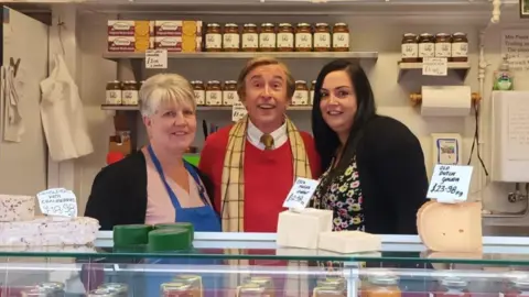 Steve Coogan with Paula Taylor (r) and Zoe Brown (r)