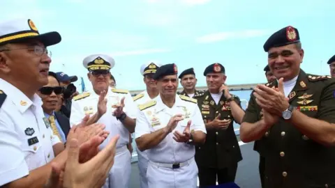 Reuters Venezuela's Defence Minister Vladimir Padrino Lopez (R) attends the arrival ceremony of the China's People's Liberation Army (PLA) Navy hospital ship Peace Ark at the port in La Guaira, Venezuela September 22, 2018.