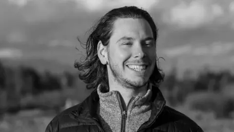 A black and white profile picture of Antoine Forest