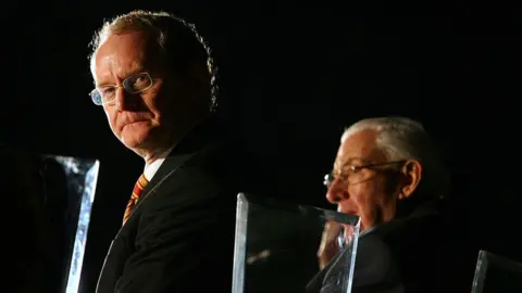 PETER MUHLY/AFP via Getty Images Martin McGuinness and Ian Paisley