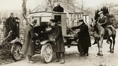 George Rinhart/Corbis via Getty Images A truck returning from Northern Ireland is stopped at the border by Irish Free State customs officers (1925)