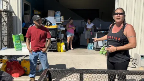 Felicia Johnson (right) is among the locals who have been coordinating efforts to help victims of the wildfires