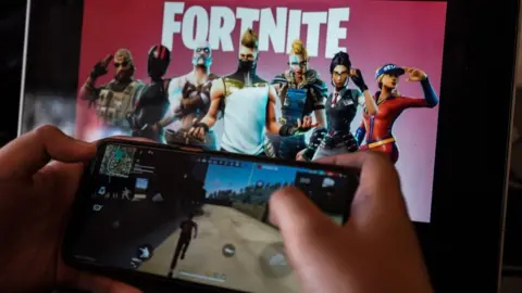 PA Media Child playing Fortnite