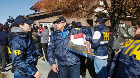 AFP The Argentine Federal Police (PFA) takes part in a raid at the house of former Argentine President and current senator Cristina Fernandez de Kirchner in Rio Gallegos, Santa Cruz Province, in southern Argentina,