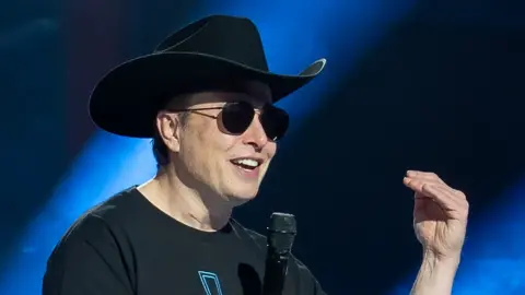 AFP Elon Musk speaks at the Tesla Giga Texas manufacturing "Cyber Rodeo" grand opening party on April 7, 2022 in Austin, Texas