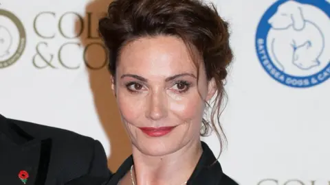 PA Sarah Parish at a gala ball in 2014