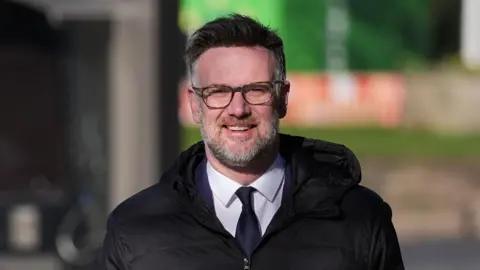 PA Media Charles Hanson smiling outside Derby Crown Court.