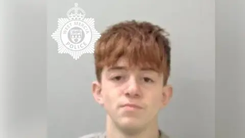 West Mercia Police A mug shot of a young man with ginger hair in a grey jumper