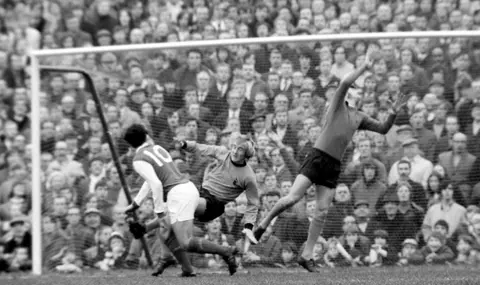 Getty Images A stretching Parkes tips a ball over the crossbar from Arsenal's Ray kennedy's header
