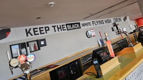 Handout Signs at the Black Cats Bar